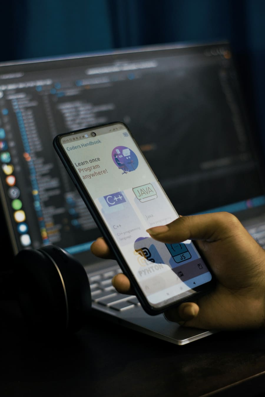 Phone app in front of a laptop during development