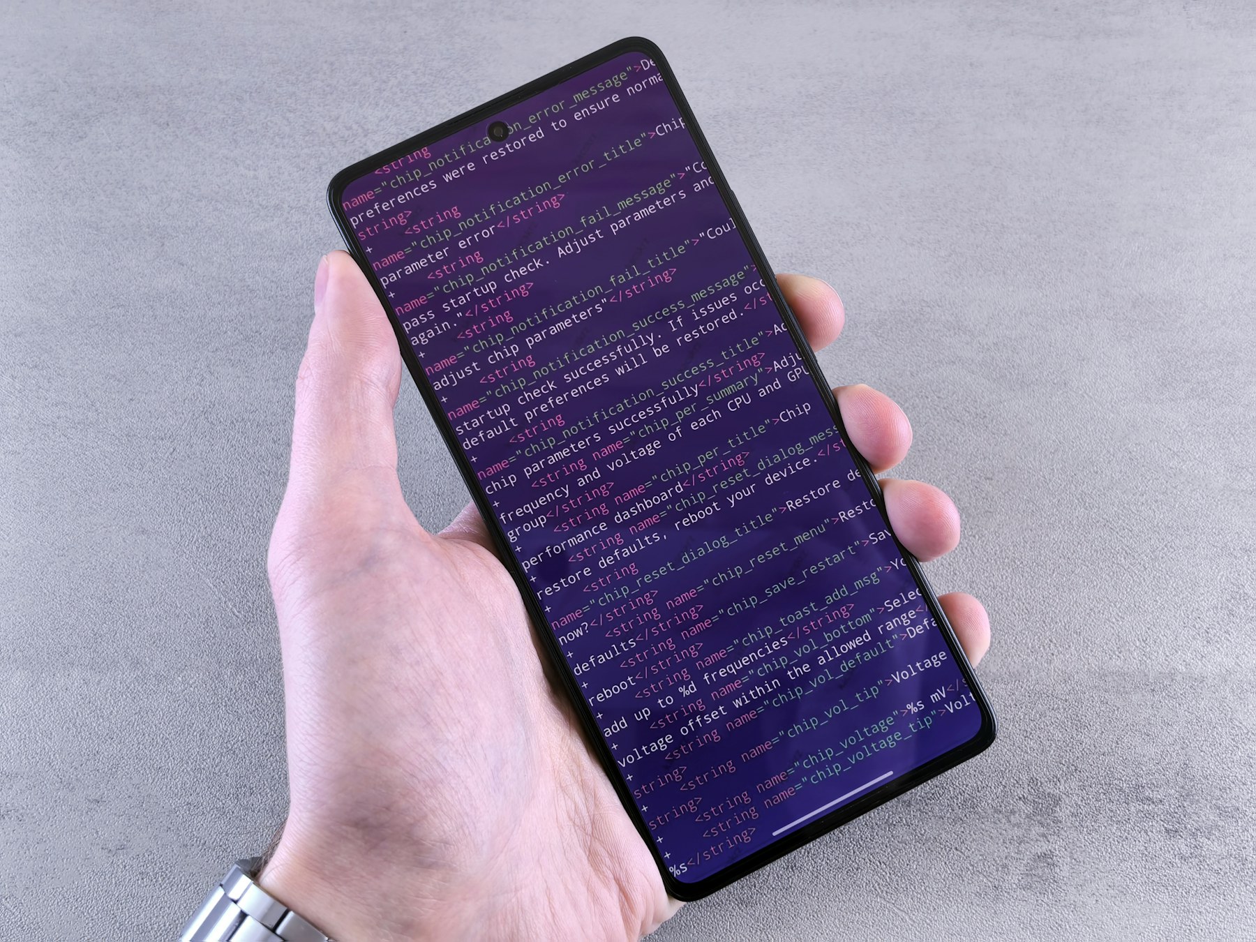 Why Mobile-Friendly Websites Matter for Local Businesses - Smartphone displaying code